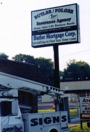 Butler Folgers Insurance Agency Sign with Bucket Truck
